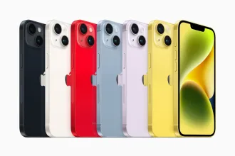 Lineup of Apple iPhone 14 models in various colors including black, white, red, blue, purple, and yellow, displayed against a white background