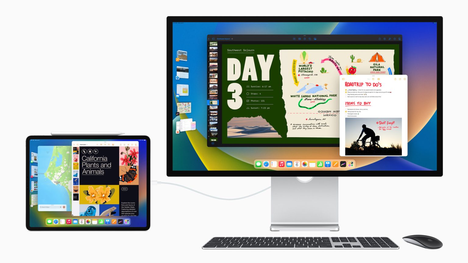 The image displays an Apple iPad connected to an external display. The iPad, positioned on the left, shows multiple app windows, including a map and a presentation on California plants and animals. The external monitor on the right mirrors the iPad’s content with a focus on a detailed road trip plan. A wireless keyboard and mouse are placed in front of the external display,