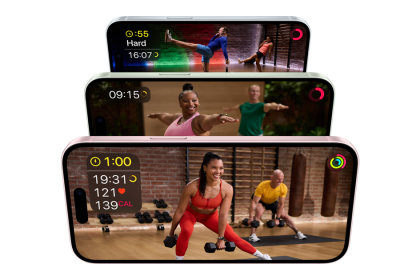 The image shows three iPhones stacked vertically, each displaying a different Apple Fitness+ workout. The top iPhone shows a HIIT workout with the timer and intensity level displayed. The middle iPhone features a yoga session with the duration shown. The bottom iPhone displays a strength training workout with details like time, heart rate, and calories burned. The screens show vibrant, energetic scenes with instructors and participants engaging in various exercises.