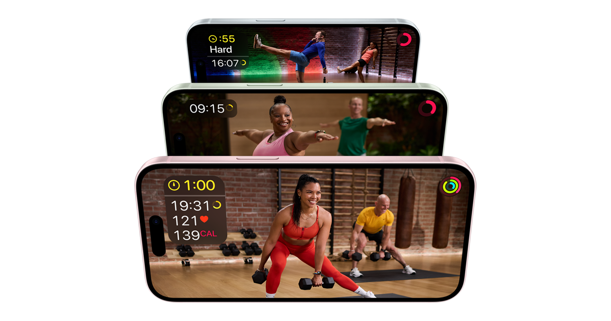 The image shows three iPhones stacked vertically, each displaying a different Apple Fitness+ workout. The top iPhone shows a HIIT workout with the timer and intensity level displayed. The middle iPhone features a yoga session with the duration shown. The bottom iPhone displays a strength training workout with details like time, heart rate, and calories burned. The screens show vibrant, energetic scenes with instructors and participants engaging in various exercises.