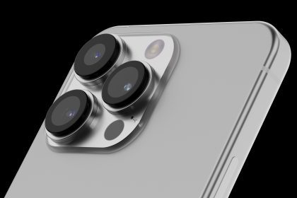 Close-up view of an iPhone 15 Ultra showcasing its advanced camera system against a black background. The image highlights the device’s sleek design with a focus on its triple-camera setup, each lens prominently protruding from the back of the phone. The lenses are arranged in a triangular formation within a raised, polished metal module.